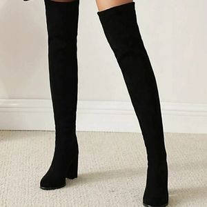 Black heel over the knee boots